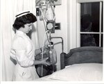 Nurse S. Reicher with Special Care Unit Equipment c.1958 by Maine Medical Center